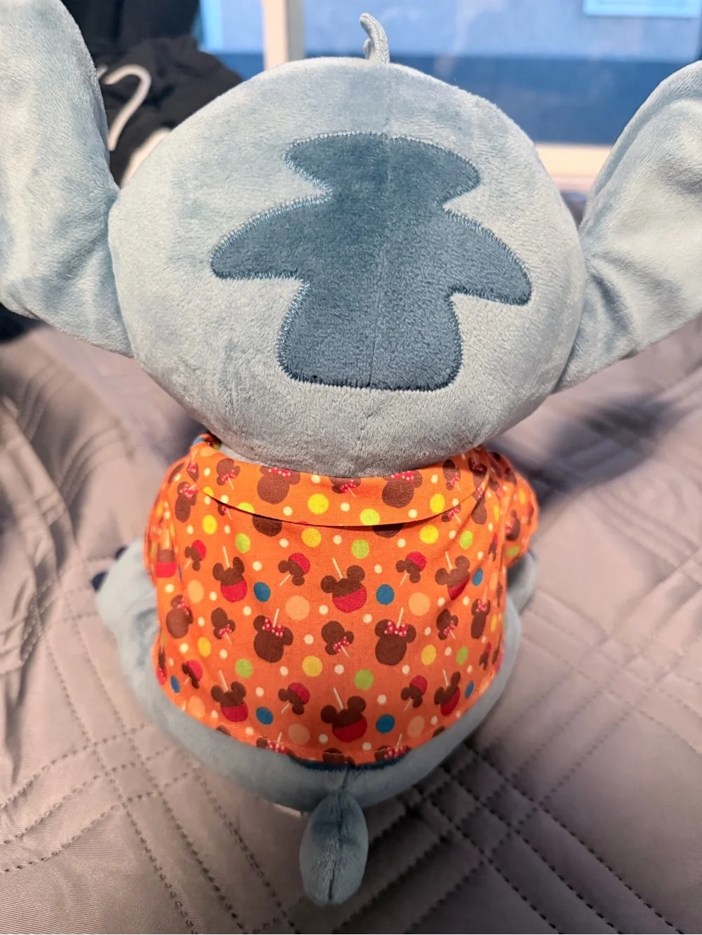 Disney Blue Stitch Plush with Pink Ears Holding Red & Brown Treat